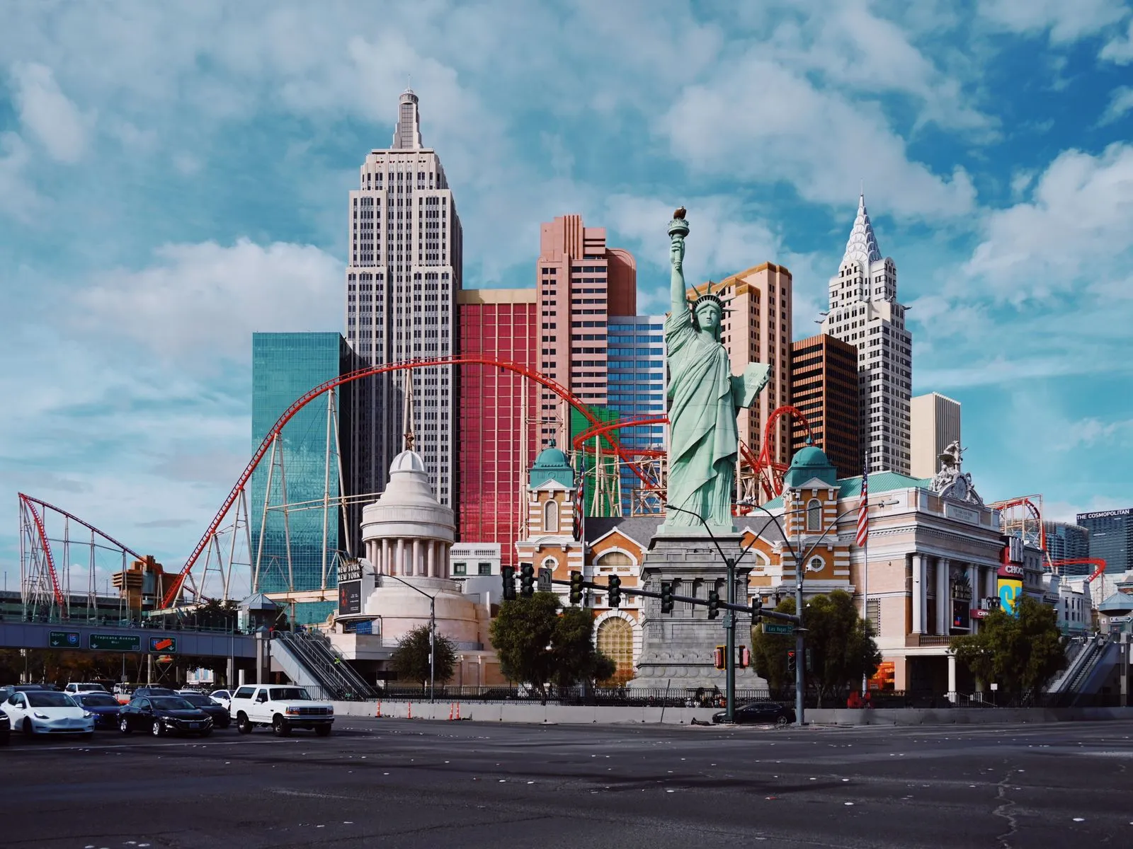 Replica of the New York skyline at a Las Vegas resort, with the Statue of Liberty, skyscrapers and a red roller coaster